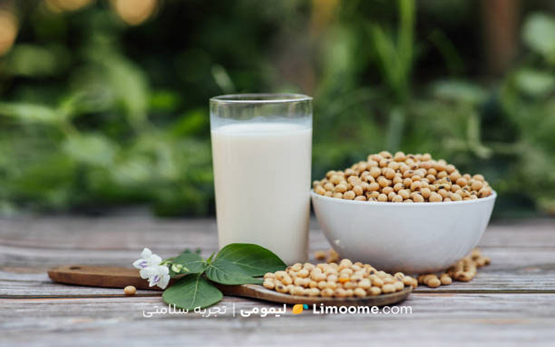 Delicious soy milk on wooden table background with Sunlight in the morning. Fresh healthy drink concept.